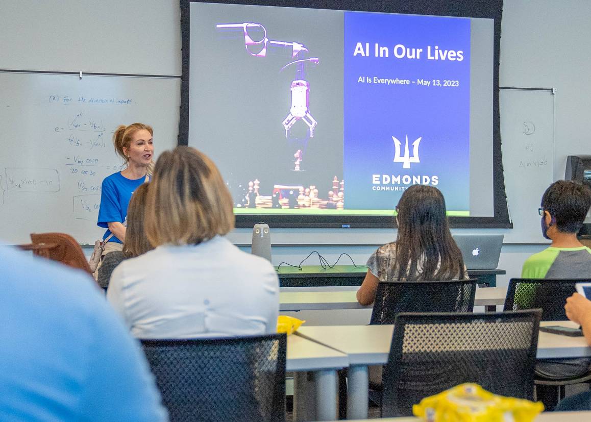 Edmonds College STEM dean Dr. Carey Schroyer addresses participants during the 2023 AI for Everyone event. (Arutyun Sargsyan / Edmonds College)